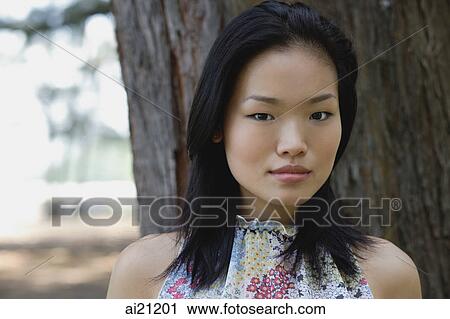 Young woman outdoors, head shot View Large Photo Image Stock Image - Young woman outdoors, head shot. Fotosearch