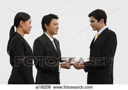 Business people exchanging name cards View Large Photo Image Stock Photo - Business people exchanging name cards. Fotosearch