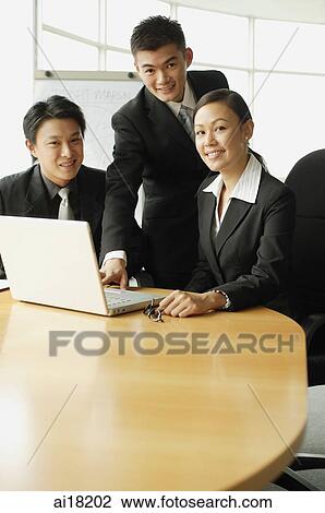 Business people in office, looking at camera View Large Photo Image Stock Image - Business people in office, looking at camera. Fotosearch