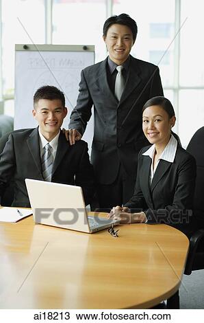 Business people in office, looking at camera View Large Photo Image Stock Image - Business people in office, looking at camera. Fotosearch