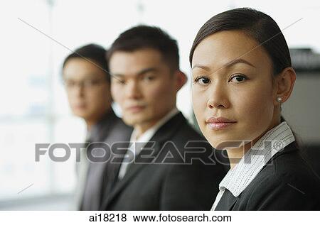 Business people seating in a row, focus on the woman View Large Photo Image Stock Photo - Business people seating in a row, focus on the woman. Fotosearch