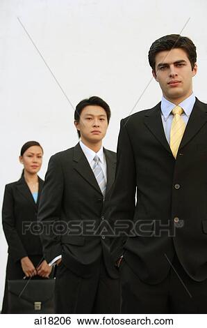 Business people standing in a row View Large Photo Image Stock Photograph - Business people standing in a row. Fotosearch