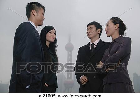 Business people talking, Oriental Pearl TV Tower in the background View Large Photo Image Stock Photography - Business people talking, Oriental Pearl TV Tower in the background. Fotosearch