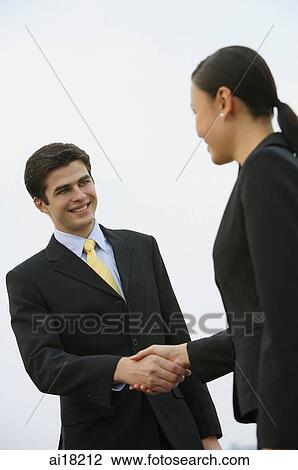 Businessman and businesswoman shaking hands View Large Photo Image Stock Image - Businessman and businesswoman shaking hands. Fotosearch