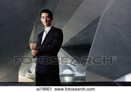 Businessman in tunnel, looking at camera, portrait View Large Photo Image Stock Image - Businessman in tunnel, looking at camera, portrait. Fotosearch