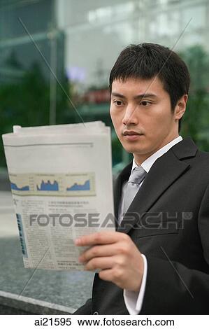 Businessman using reading newspaper View Large Photo Image Stock Photography - Businessman using reading newspaper. Fotosearch