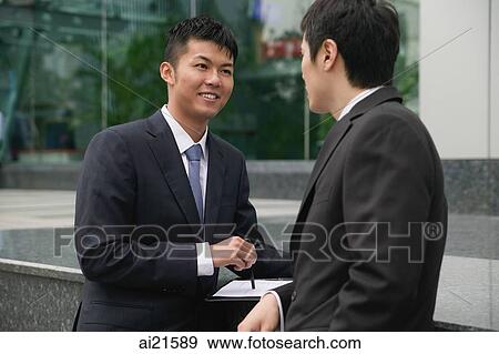 Businessmen talking View Large Photo Image Stock Photo - Businessmen talking. Fotosearch