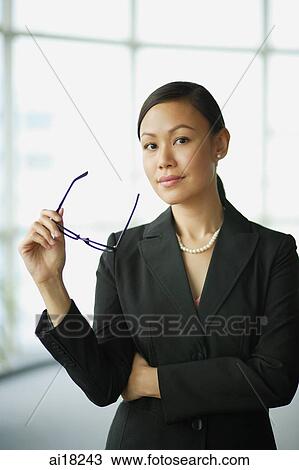 Businesswoman looking at camera, portrait View Large Photo Image Stock Image - Businesswoman looking at camera, portrait. Fotosearch