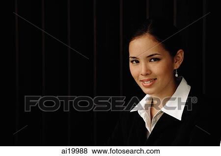 Stock Photo - Businesswoman smiling at camera, portrait. Fotosearch