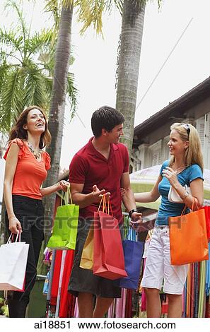 Stock Image - Caucasian tourists in Arab street, Singapore. Fotosearch