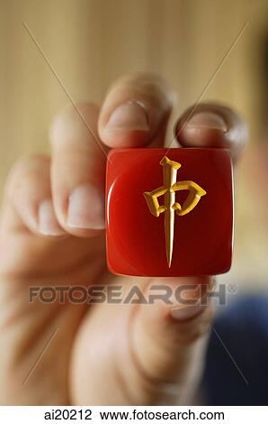 Close-up of hand holding red mahjong tile with Chinese script View Large Photo Image Stock Image - Close-up of hand holding red mahjong tile with Chinese script. Fotosearch