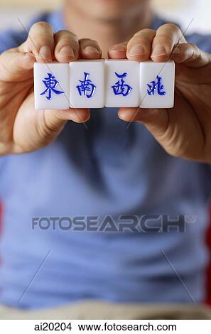Close up of mahjong tiles with Chinese characters for East, South, West and North View Large Photo Image Picture - Close up of mahjong tiles with Chinese characters for East, South, West and North. Fotosearch