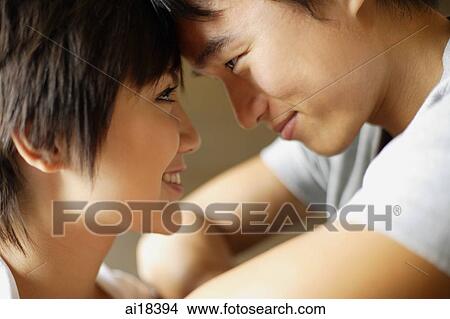 Couple face to face, foreheads touching View Large Photo Image Picture - Couple face to face, foreheads touching. Fotosearch