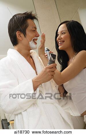 Couple in bathroom, woman applying shaving cream on man's nose View Large Photo Image Stock Image - Couple in bathroom, woman applying shaving cream on man's nose. Fotosearch