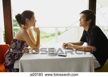 Couple in restaurant, talking View Large Photo Image Stock Image - Couple in restaurant, talking. Fotosearch