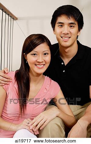 Couple looking at camera, portrait View Large Photo Image Stock Photo - Couple looking at camera, portrait. Fotosearch
