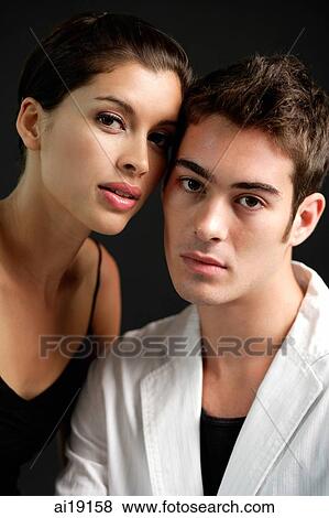 Stock Photo - Couple looking at camera. Fotosearch