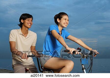 Couple on tandem bicycle View Large Photo Image Stock Image - Couple on tandem bicycle. Fotosearch