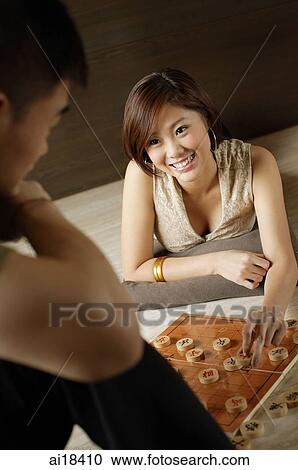Couple playing Chinese chess View Large Photo Image Stock Image - Couple playing Chinese chess. Fotosearch