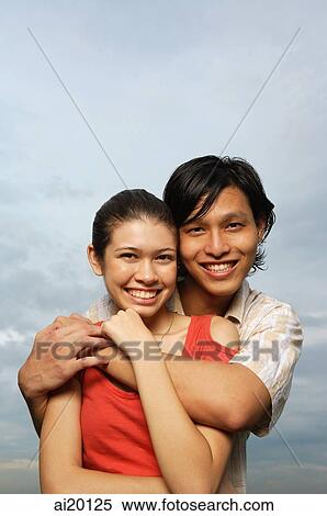 Couple smiling at camera, portrait View Large Photo Image Stock Photography - Couple smiling at camera, portrait. Fotosearch