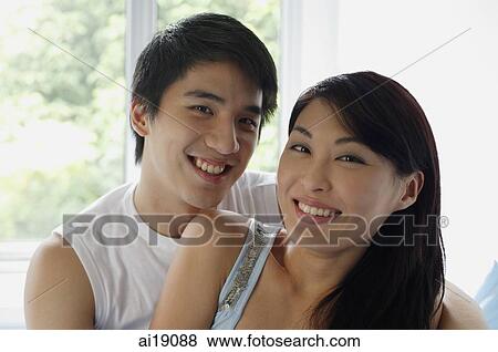 Stock Photo - Couple smiling at camera. Fotosearch