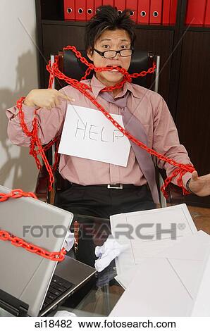 Executive tied to chair by red chain View Large Photo Image Stock Image - Executive tied to chair by red chain. Fotosearch