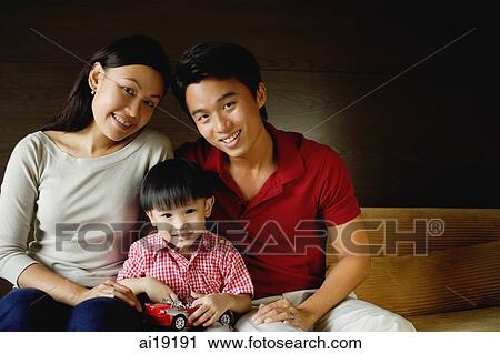 Family of three, smiling at camera, portrait View Large Photo Image Stock Image - Family of three, smiling at camera, portrait. Fotosearch
