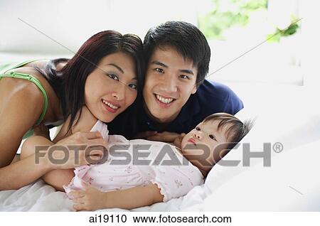 Family with one child, portrait View Large Photo Image Stock Image - Family with one child, portrait. Fotosearch