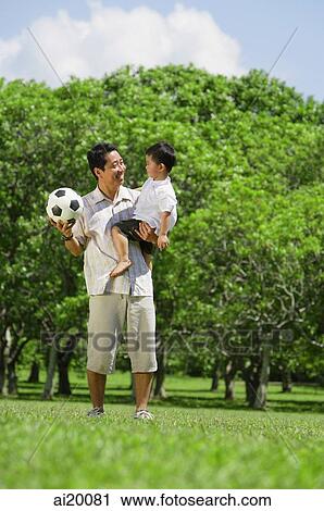 Father carrying young son View Large Photo Image Stock Image - Father carrying young son. Fotosearch