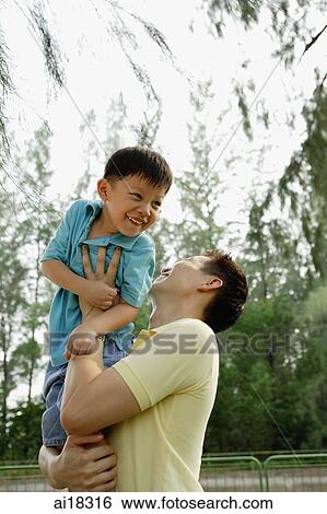 Father lifting son View Large Photo Image Stock Photograph - Father lifting son. Fotosearch