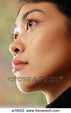 Female executive looking away, head shot View Large Photo Image Stock Image - Female executive looking away, head shot. Fotosearch