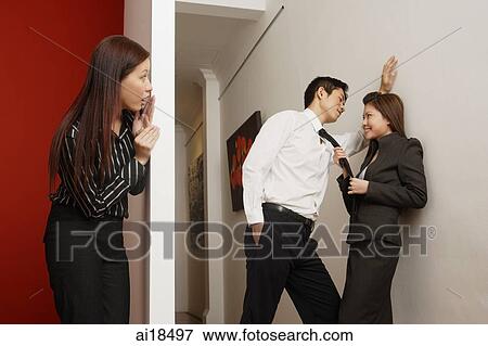 Female executive spying on two colleagues flirting View Large Photo Image Stock Photo - Female executive spying on two colleagues flirting. Fotosearch