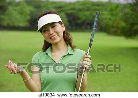 Female golfer smiling at camera View Large Photo Image Picture - Female golfer smiling at camera. Fotosearch