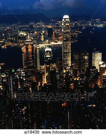 Stock Photography - Hong Kong, early evening, Central, Victoria harbour and Kowloon, view from the Peak. Fotosearch