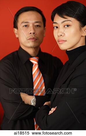 Male and female executive looking at camera, portrait View Large Photo Image Stock Photography - Male and female executive looking at camera, portrait. Fotosearch