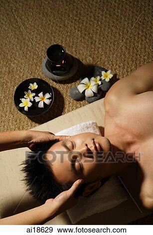 Stock Photo - Man being massaged. Fotosearch
