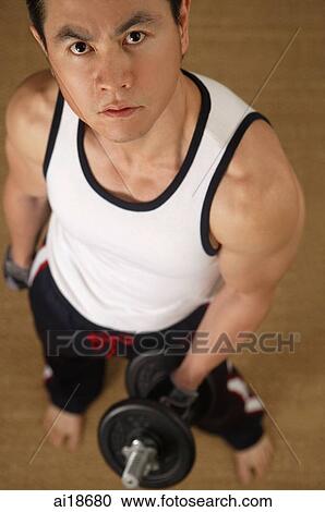 Man carrying barbell, looking up at camera View Large Photo Image Stock Image - Man carrying barbell, looking up at camera. Fotosearch