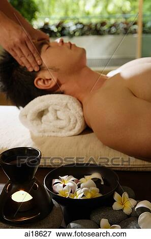 Man having head massaged View Large Photo Image Stock Photo - Man having head massaged. Fotosearch