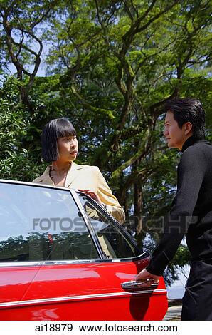 Man holding car door open for woman View Large Photo Image Stock Photo - Man holding car door open for woman. Fotosearch