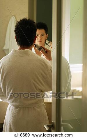 Man in bathrobe, shaving View Large Photo Image Stock Photo - Man in bathrobe, shaving. Fotosearch