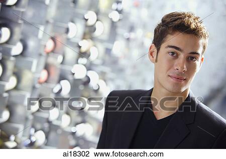 Man in wine cellar looking at camera View Large Photo Image Stock Image - Man in wine cellar looking at camera. Fotosearch
