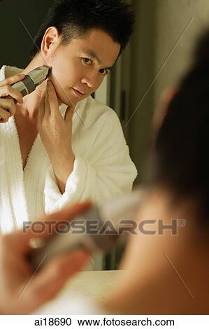 Man looking in mirror, shaving View Large Photo Image Stock Image - Man looking in mirror, shaving. Fotosearch