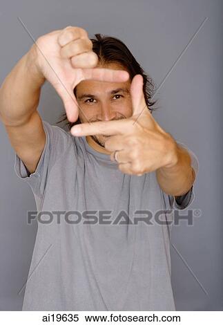 Man making square shape with his fingers View Large Photo Image Stock Photography - Man making square shape with his fingers. Fotosearch