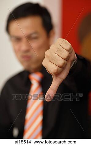 Man making thumbs down sign, selective focus View Large Photo Image Picture - Man making thumbs down sign, selective focus. Fotosearch