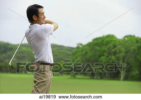 Stock Photo - Man playing golf. Fotosearch