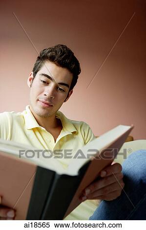 Man sitting and reading book View Large Photo Image Stock Photography - Man sitting and reading book. Fotosearch