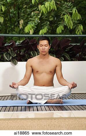 Man sitting in yoga position, meditating View Large Photo Image Stock Photography - Man sitting in yoga position, meditating. Fotosearch