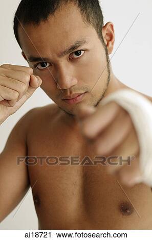 Man with bandage around his hand, boxing View Large Photo Image Stock Image - Man with bandage around his hand, boxing. Fotosearch