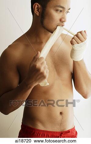Man with bandage around his hand, biting a segment of bandage View Large Photo Image Stock Image - Man with bandage around his hand, biting a segment of bandage. Fotosearch
