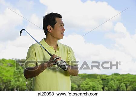 Man with gold club over his shoulder, looking away View Large Photo Image Stock Photo - Man with gold club over his shoulder, looking away. Fotosearch